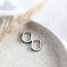 Load image into Gallery viewer, Oval Huggie Hoop Earrings - Silver

